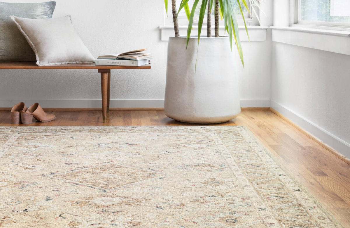 Bright, airy space with a pale vintage-style rug that enhances natural light and creates the illusion of a larger, more open room