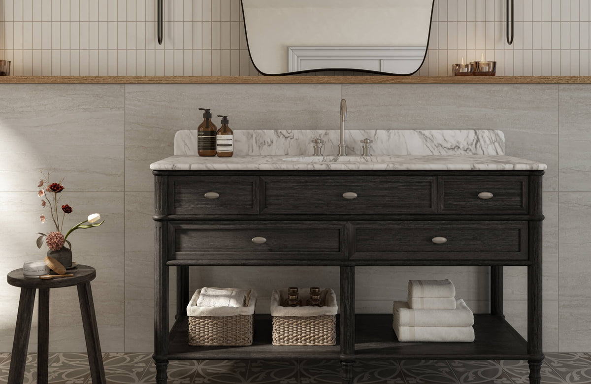 Transitional bathroom with a dark wood vanity with mirror, marble countertop, and a mix of large stone look tiles and vertical straight lay wall tiles.