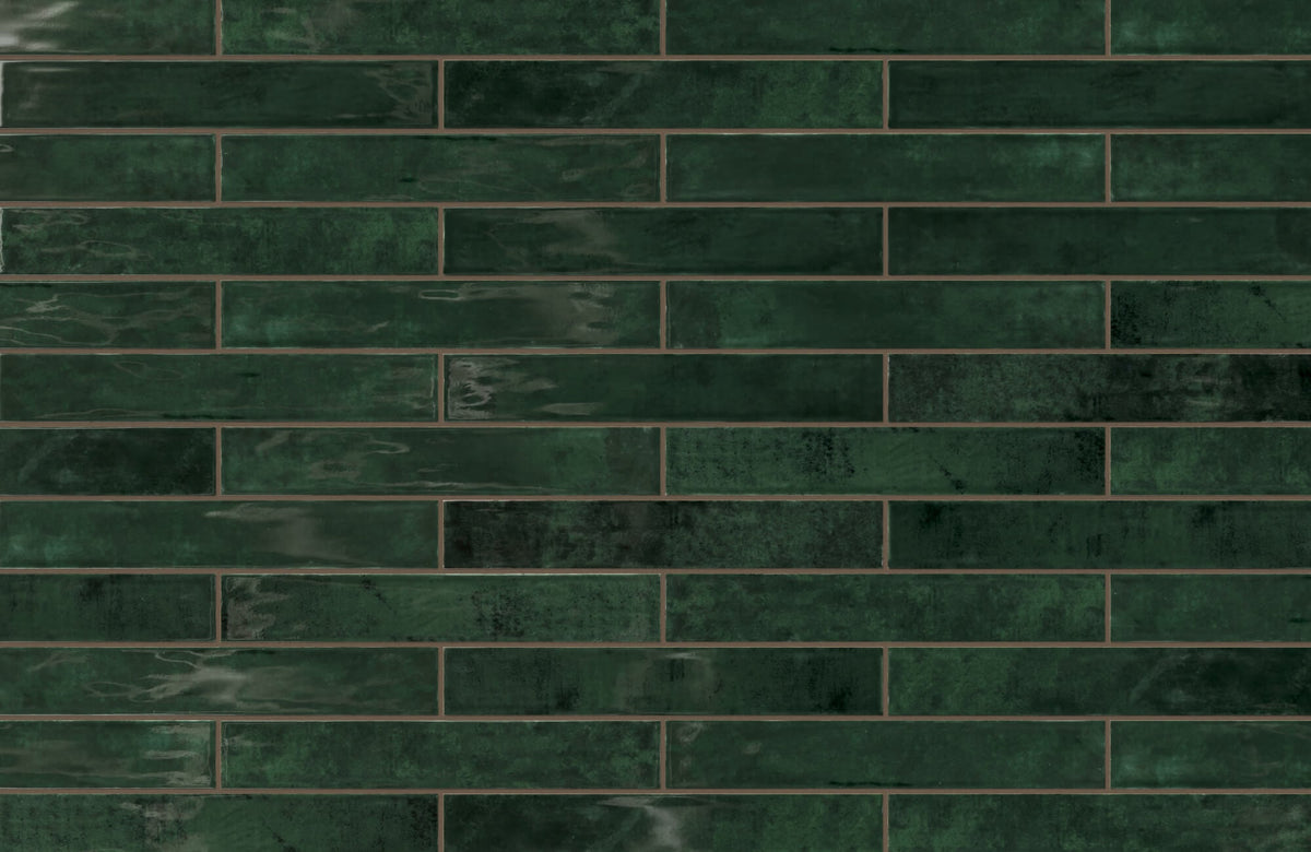 Jaden 2.5x16 glossy ceramic tile in Hunter green boasts a rich, vibrant finish, ideal for adding depth and sophistication to any space.