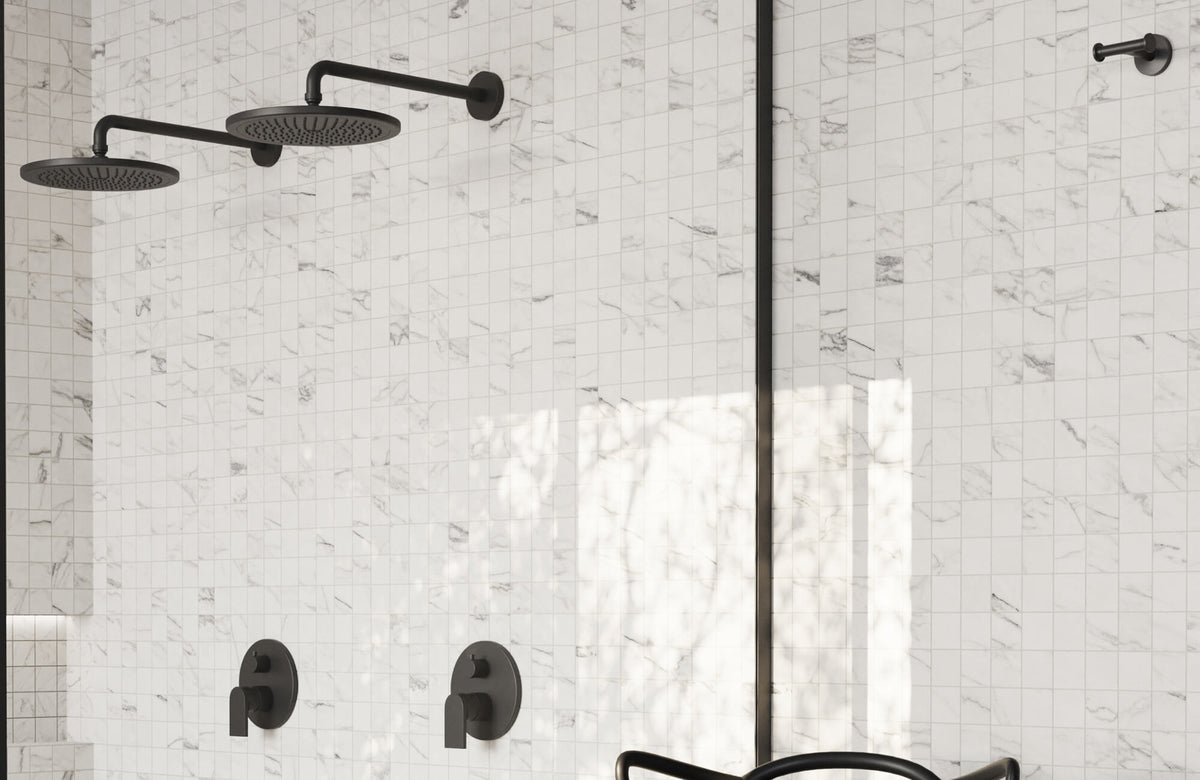 Marble look mosaic shower wall with dual black fixtures, offering a clean, water-resistant surface ideal for modern bathrooms.