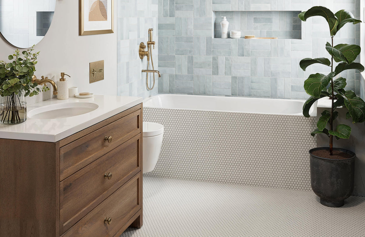 Penny tile floor and soft blue wall tiles create a slip-resistant, kid-friendly bathroom with easy-to-clean surfaces.