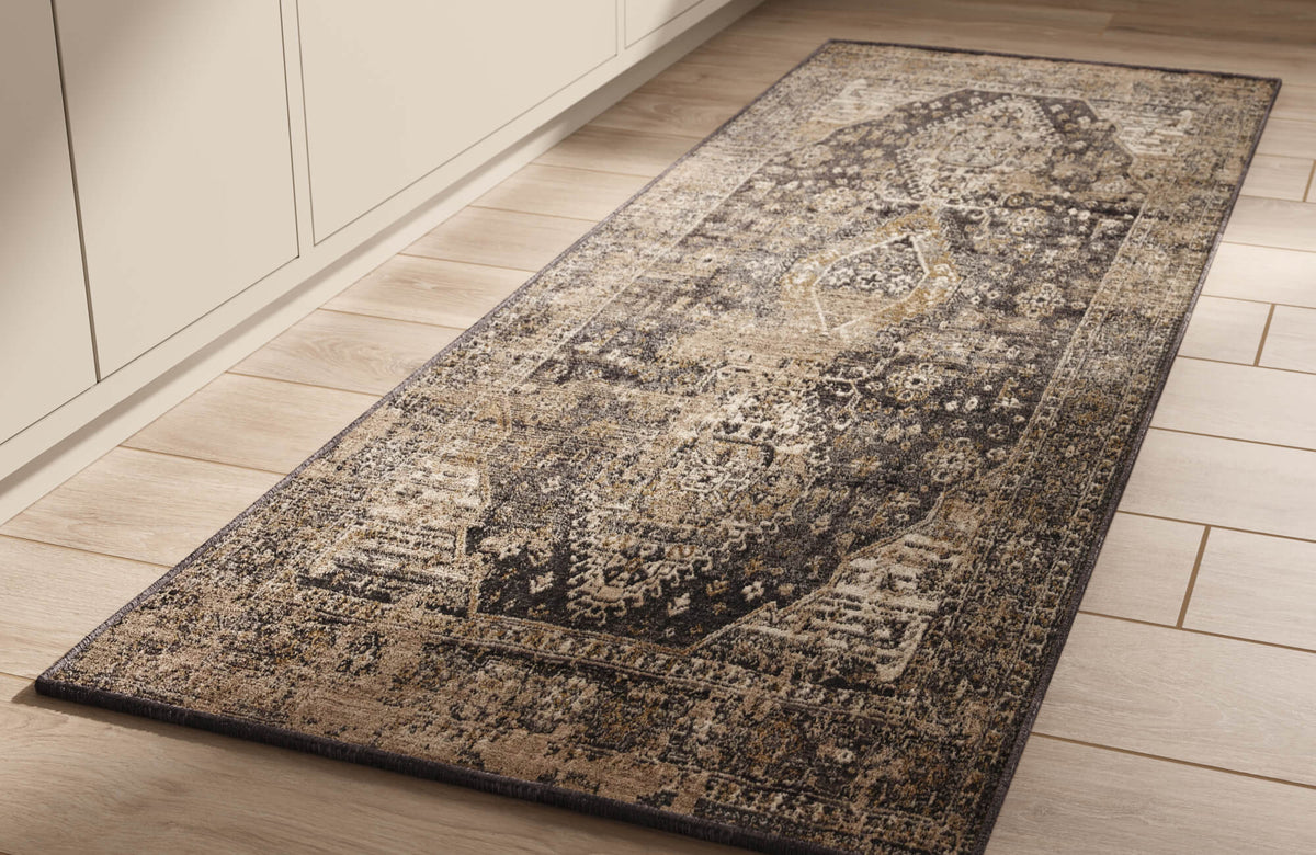 A low-pile vintage-style rug brings softness underfoot and everyday comfort to this kitchen, with a muted pattern that helps conceal daily wear.