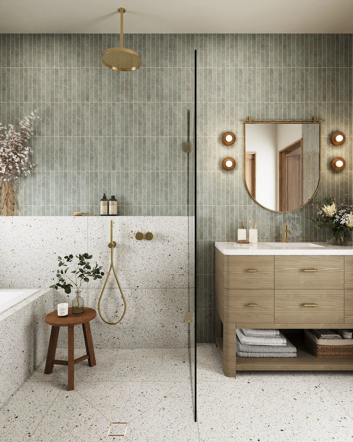 Chic bathroom with veined marble wall tiles behind a modern stone basin