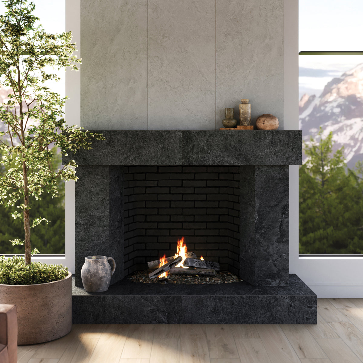 A lavish fireplace adorned with Quartzite Look Dawson 24x48 Matte Porcelain Tiles in Charcoal, creating a dramatic and elegant contrast against the pristine Dawson 24x48 Matte Porcelain Tiles in Alabaster. The harmonious pairing exudes a sophisticated atmosphere, blending the raw, natural essence of quartzite with the refined quality of porcelain, making it a focal point of luxury and style.