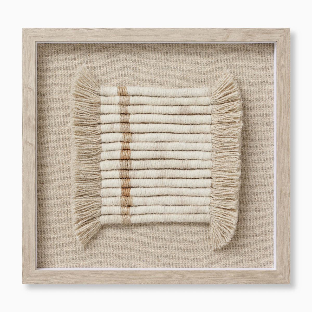 Textile wall art featuring tightly wound white wool yarn in clean linear rows, softened by cascading fringe and accented with warm beige and light brown tones.