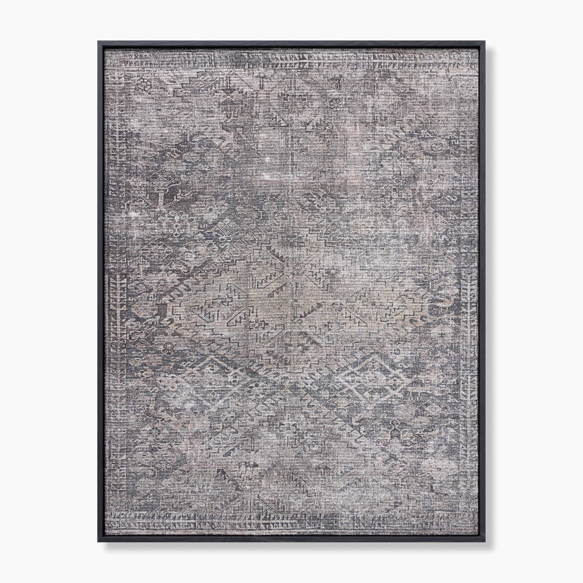 Framed wall art featuring layered geometric and tribal-inspired patterns in warm taupe and ashy gray tones, with subtle chevrons, angular symbols, and softened medallion forms that fade together for a timeworn, textured appearance.