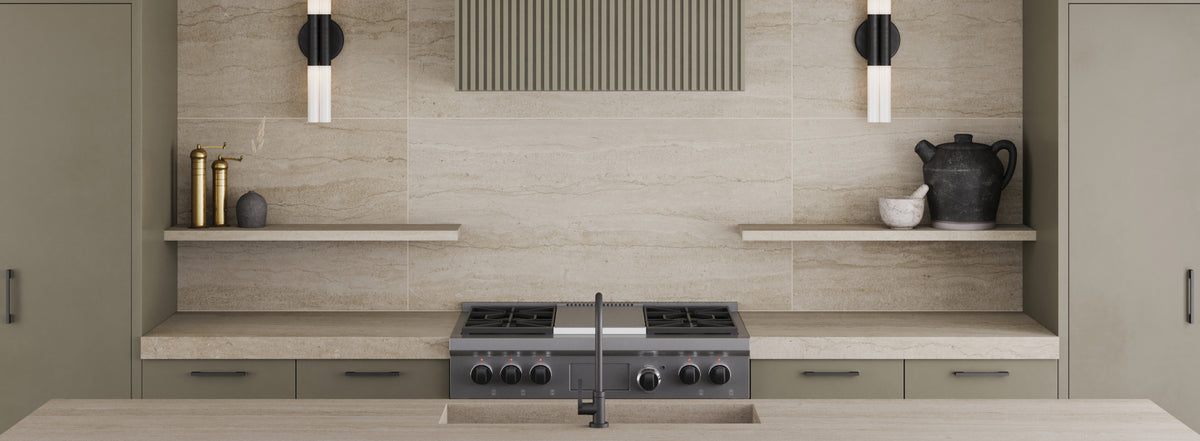 Modern kitchen featuring 24x48 travertine-look large format porcelain tiles, creating a sleek, elegant backdrop with natural charm.