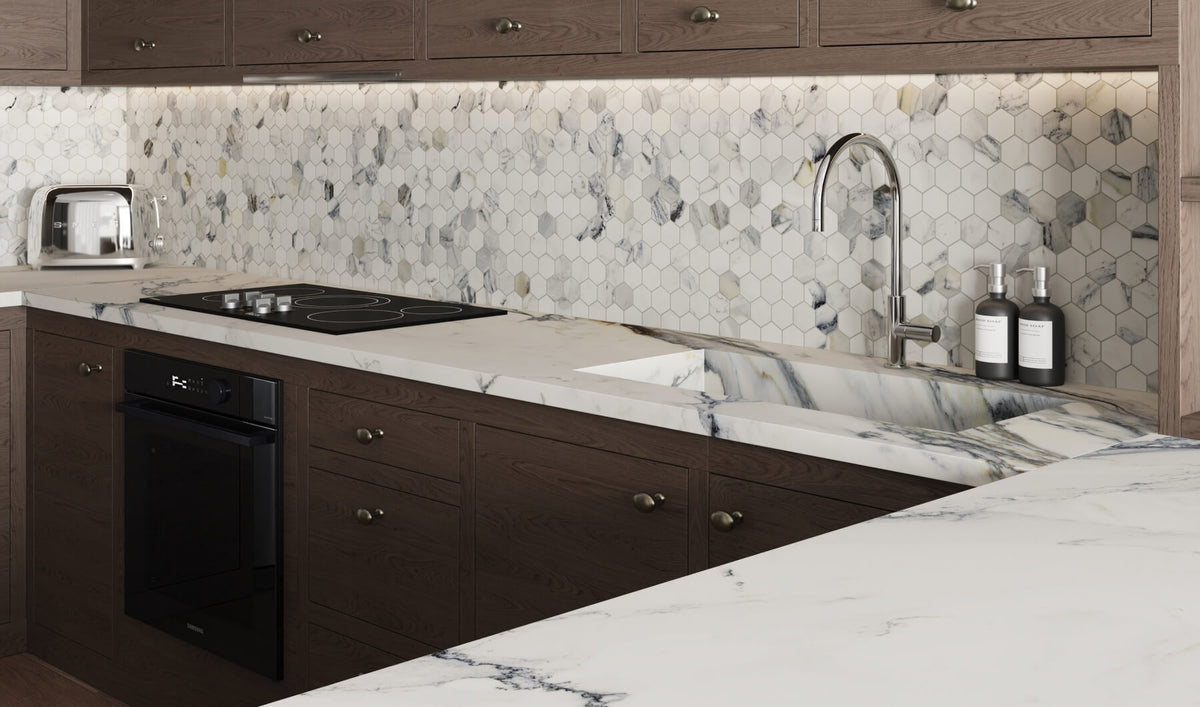 Modern kitchen with hexagonal mosaic marble look backsplash tiles, dark wood cabinets, and a sleek marble countertop, featuring stainless steel fixtures and appliances