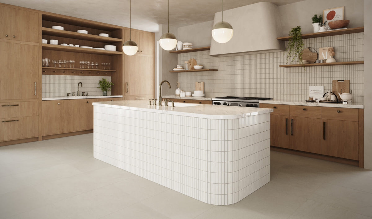 Modern kitchen featuring light wood cabinetry, white vertical subway mosaic tiles on island and backsplash, with open shelves and pendant lighting