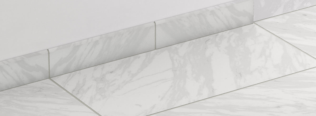 Polished white marble-look tiles with soft veining are seamlessly finished with matching edge trims, offering a refined and cohesive design.