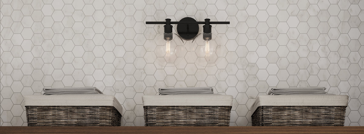 Clean white hexagonal tiles create a fresh, minimalist backdrop, accented by rustic woven baskets and a black industrial-style light fixture