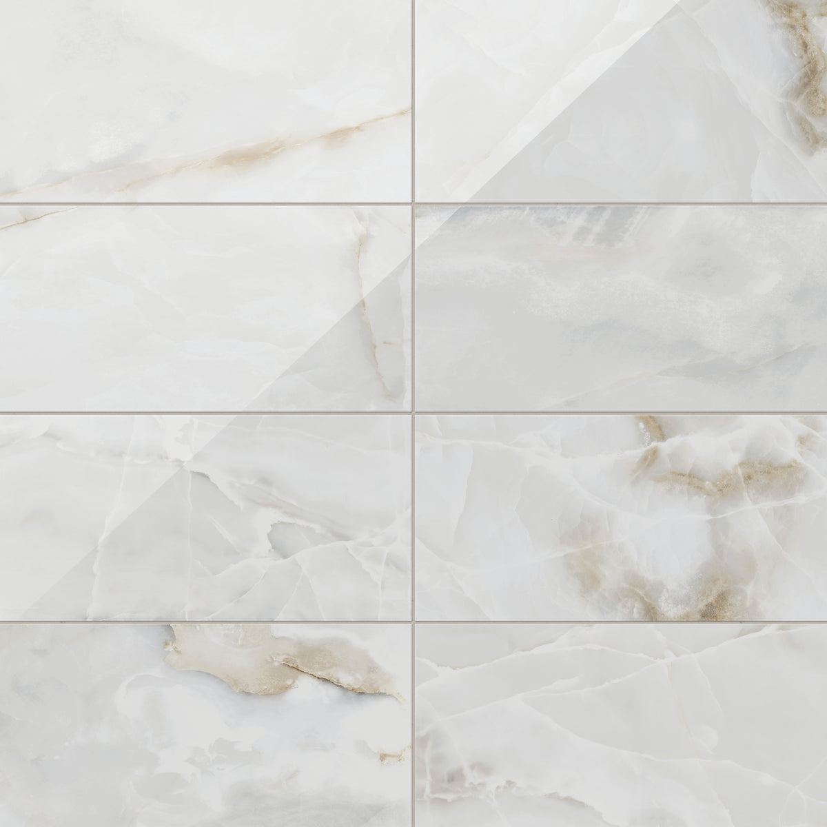 Astrid 12x24 polished porcelain tile in Pearl, showcasing a glossy surface with elegant veining and a natural marble-like design.