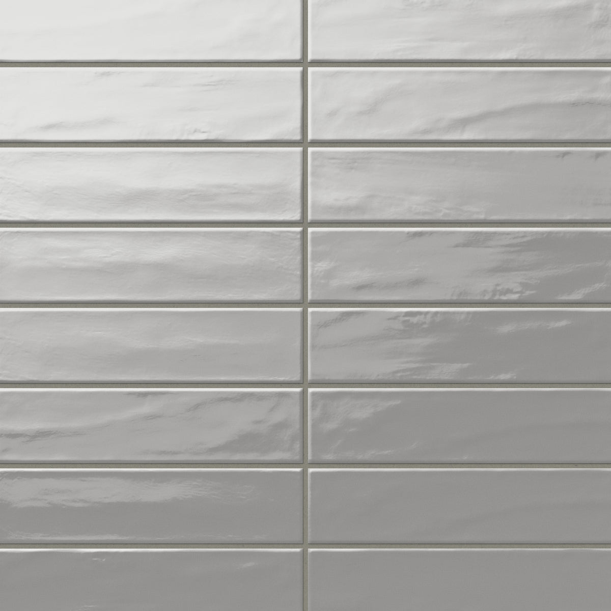 Palmer 3x12 glossy porcelain tile in grey, showcasing a polished finish and soft gray hue for timeless elegance.