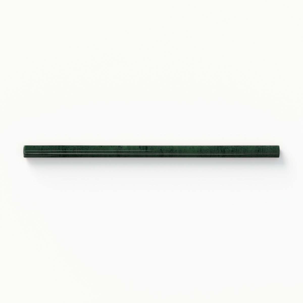 Elegant Jaden Hunter 0.75x16 pencil tile in a rich green glossy finish, adding a luxurious accent to refined interiors.