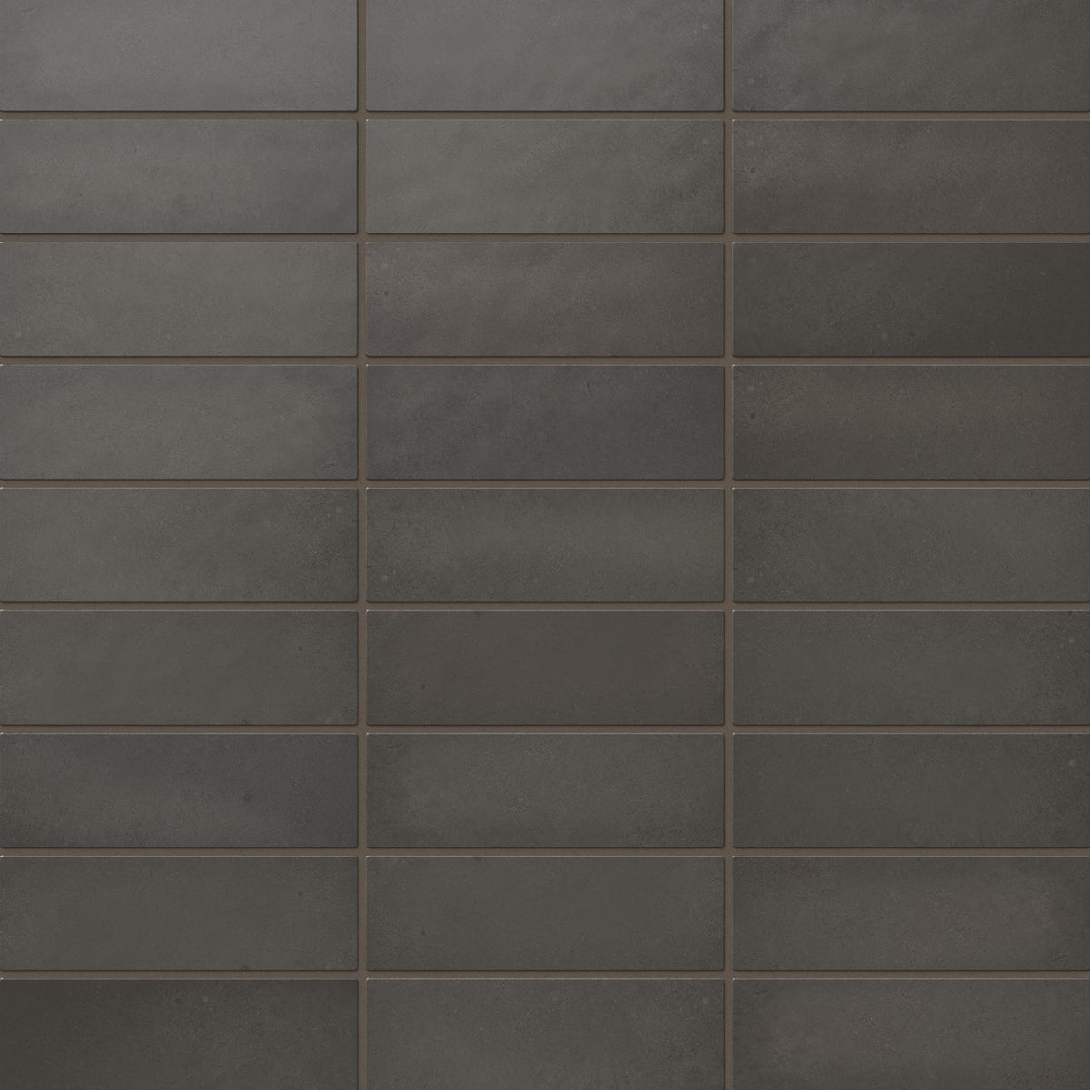 Ellie matte ceramic subway tiles with a rich, dark grayish-brown finish, perfect for bold and modern design applications