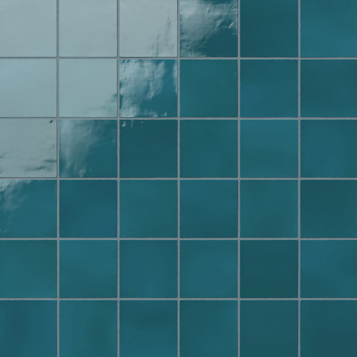 Deep blue-green 4x4 ceramic square tiles with a vibrant, glossy finish, ideal for bold and elegant interior designs