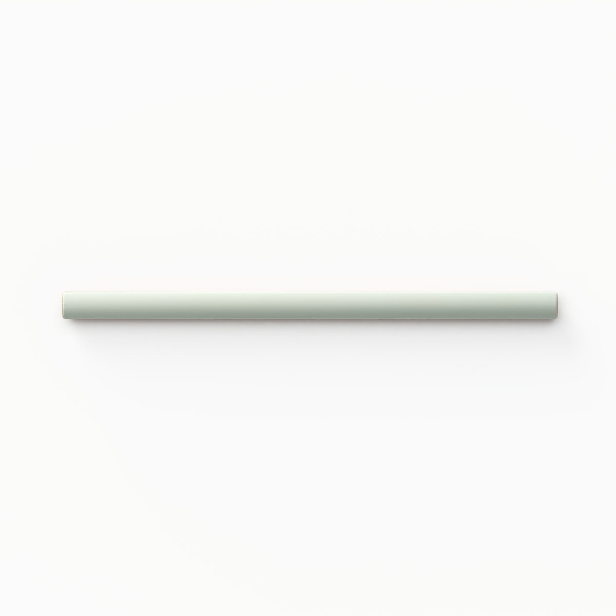 Quarter-round porcelain trim tile, featuring a soft pistachio green tone and smooth, glossy finish