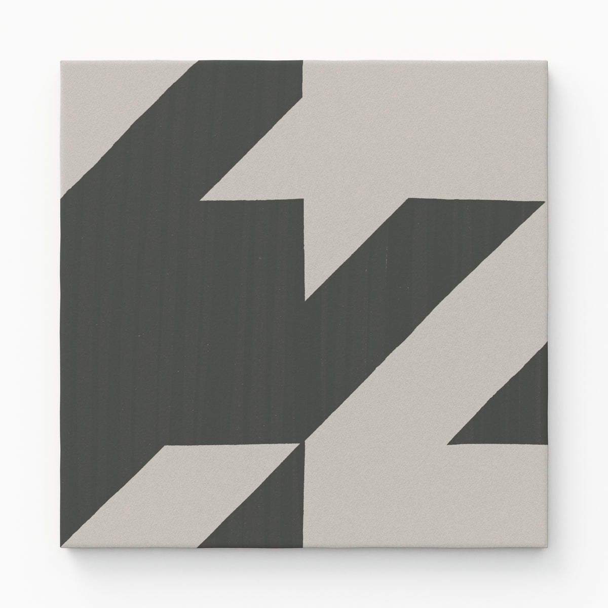 An 8x8 matte porcelain decorative tile with a striking dark and light gray zigzag pattern, evoking a modern, oversized houndstooth effect.
