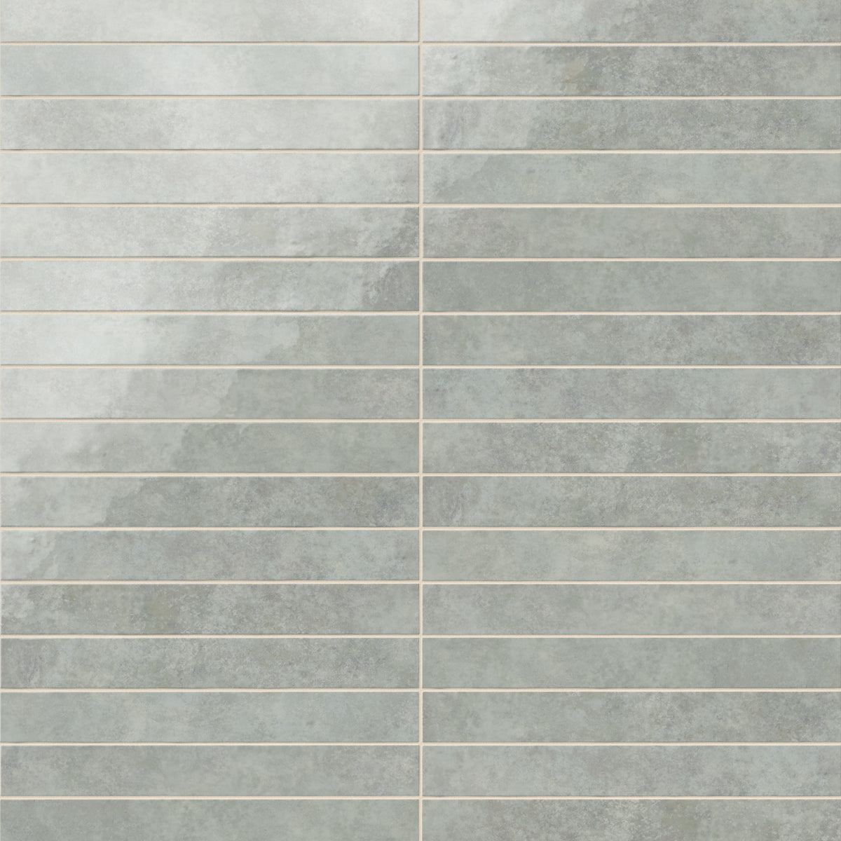 Rectangular porcelain wall tile in a glossy finish with a smooth, lightly textured surface, featuring a cool light gray color with soft natural variation.