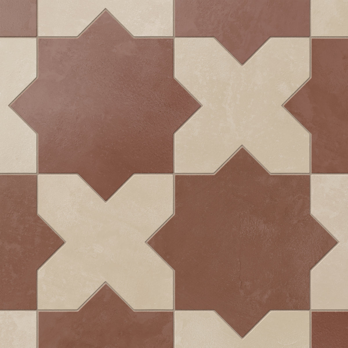 Star and cross shapes move naturally across this porcelain tile, blending red and warm beige tones with a powdery matte finish and subtle cement-plaster texture inspired by handmade terracotta.