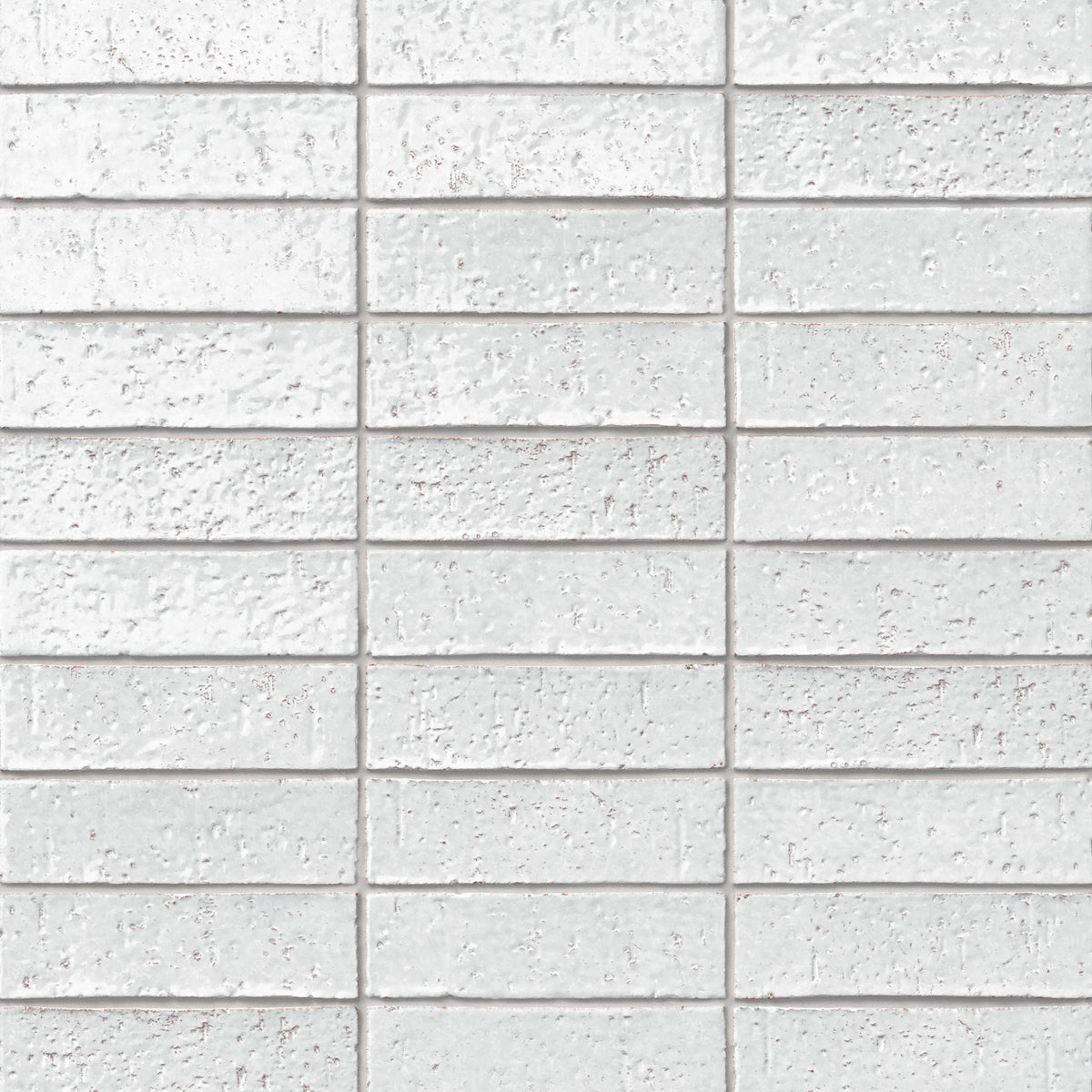 Handmade brick tiles with a gleaming white glaze, subtle dimples, pinholes, and organic surface variation.