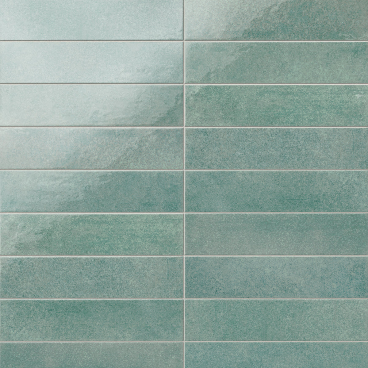 Featuring a glossy, artisan-inspired finish, this seafoam porcelain tile moves between soft blue-greens and weathered hues, bringing a relaxed coastal feel to kitchens and baths.