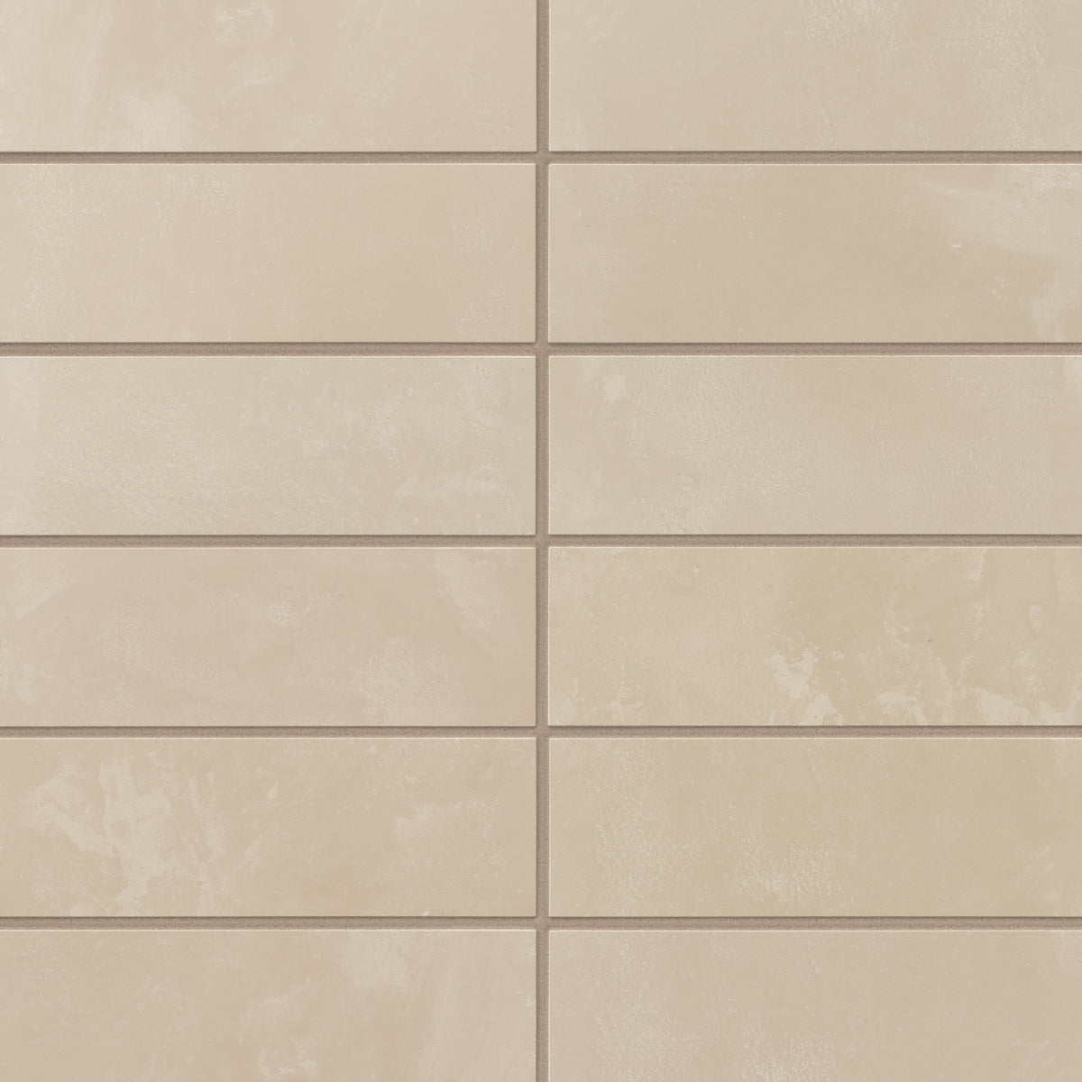 Soft warm beige porcelain subway tiles offer subtle shade variation and a powdery glaze, giving walls a calm, inviting look that suits bathrooms and timeless kitchen designs.