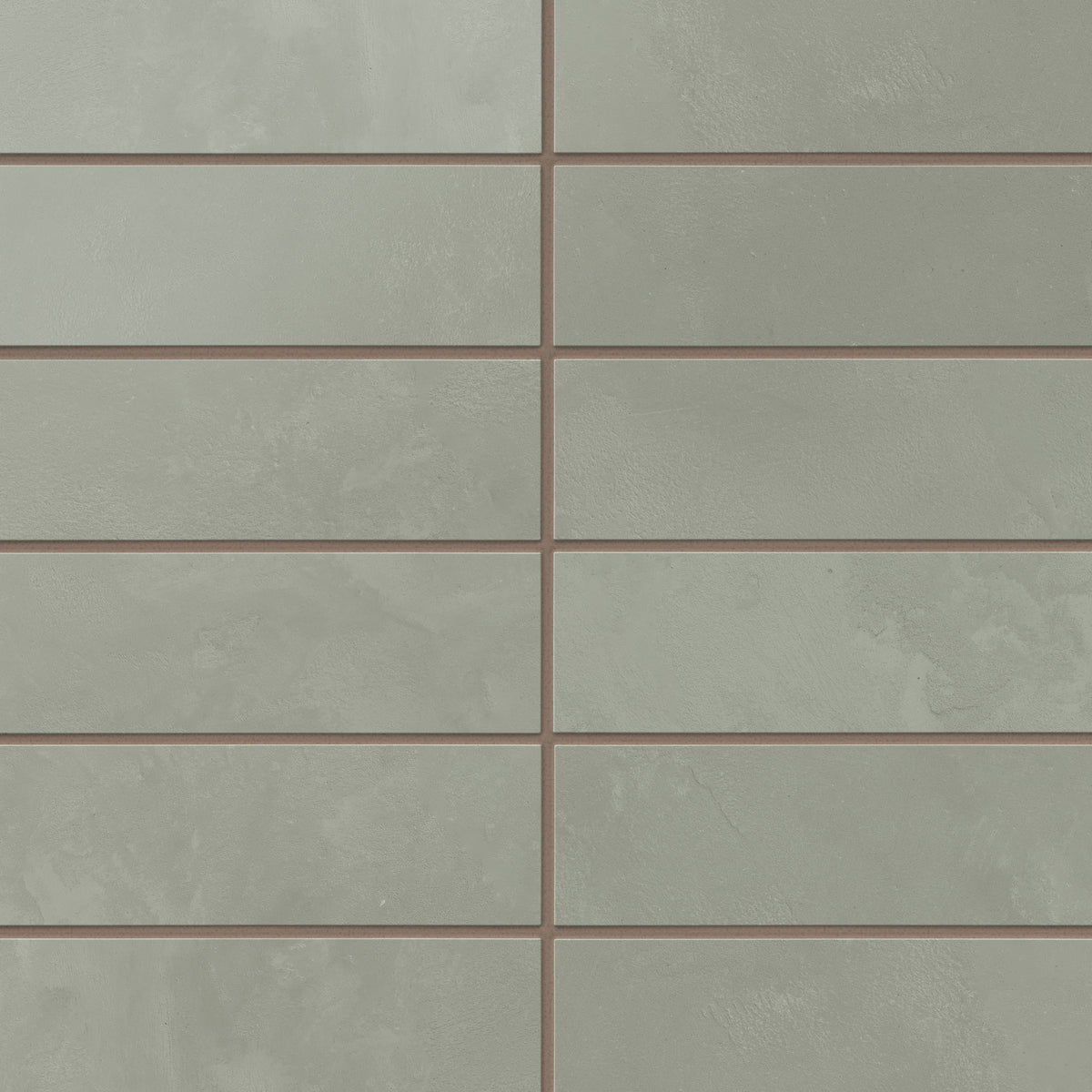 Muted sage green 2x6 porcelain subway tiles carry gentle, earth-drawn variation and a powdery matte surface, laying out easily for backsplashes and interior walls.