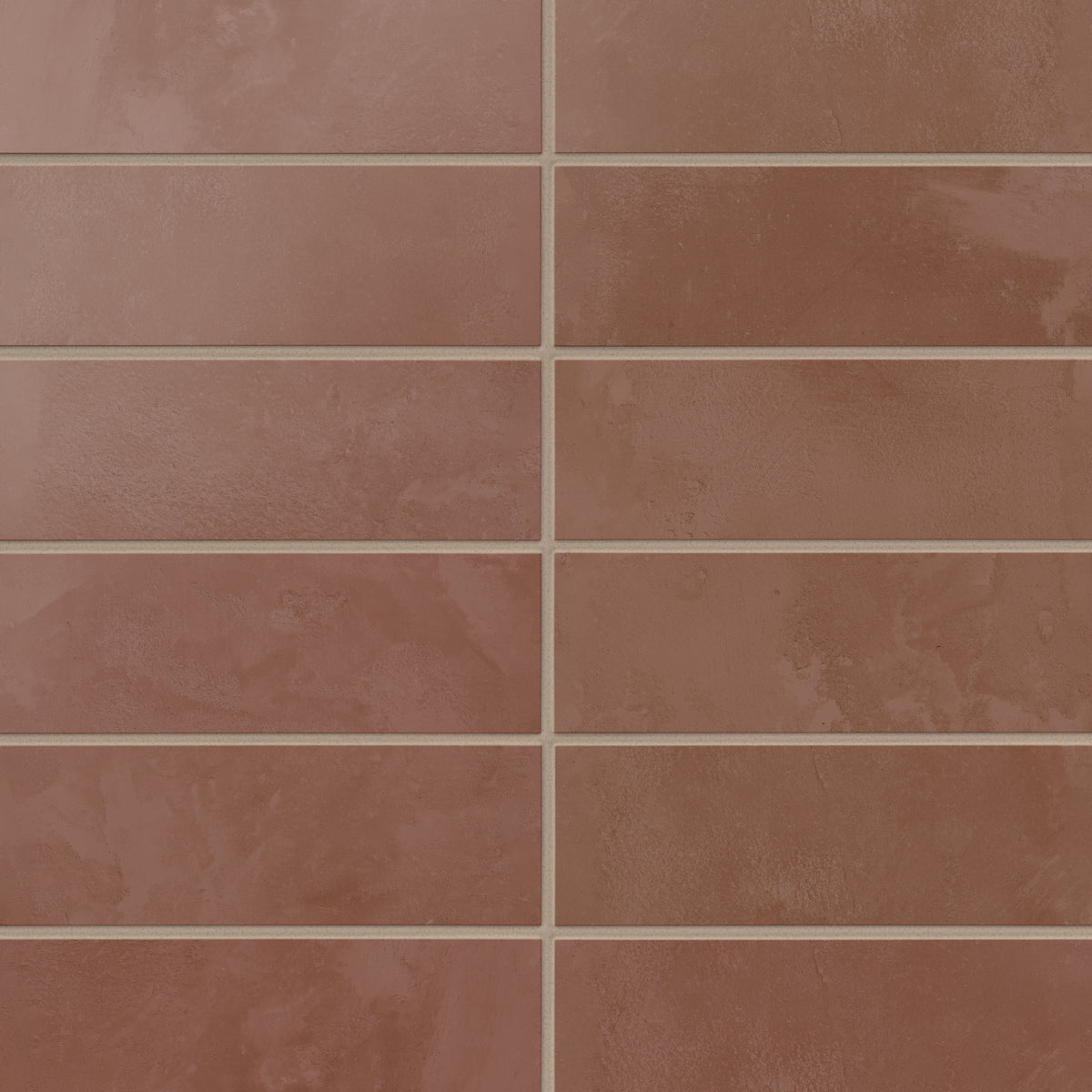 Earthy red 2x6 matte porcelain subway tiles form a clean, horizontal layout, with soft texture that gives backsplashes and accent walls a calm, tactile feel.