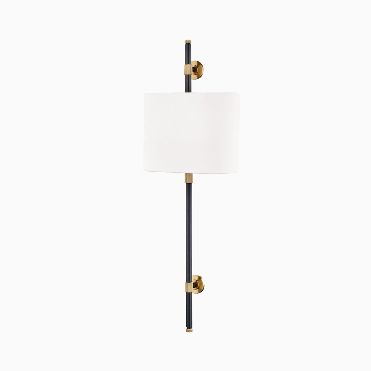 Wall sconce with white linen cylindrical shade, aged old bronze and black metal stem, and button-style mounts for soft ambient lighting.