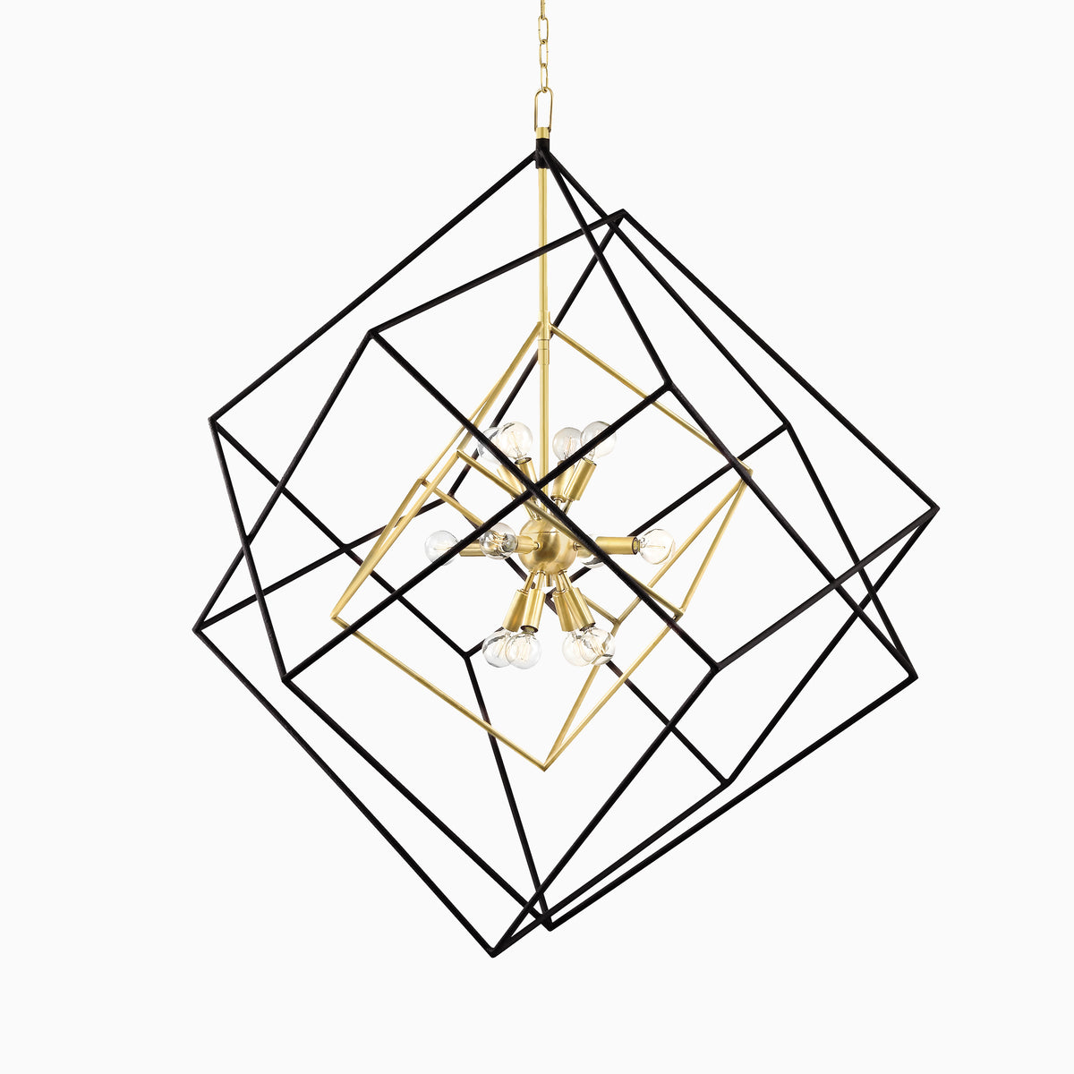 Large geometric chandelier with black intersecting frames and an aged brass starburst core featuring exposed globe light bulbs.