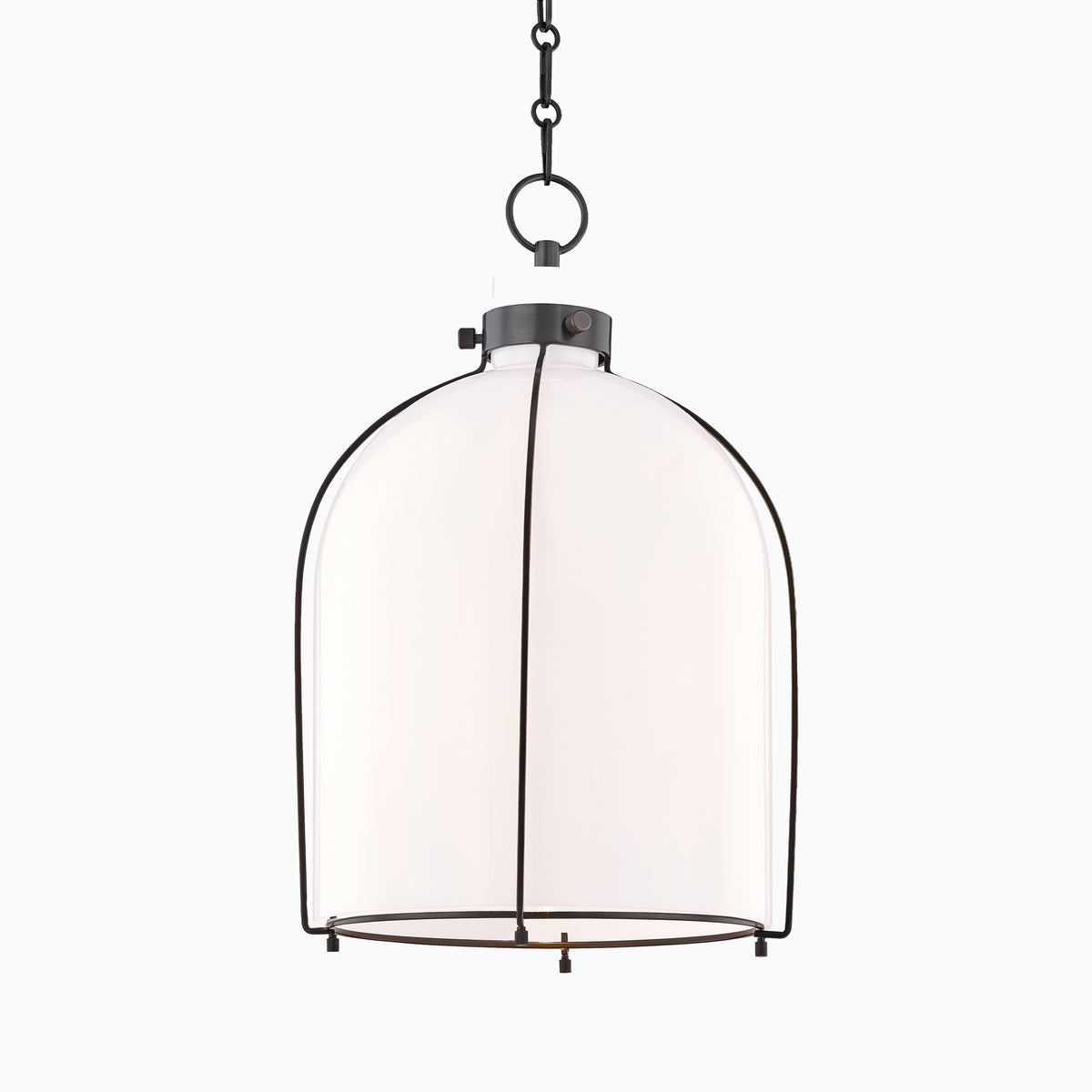 Old bronze dome pendant light with frosted glass shade and chain suspension, blending industrial structure with soft ambient lighting.