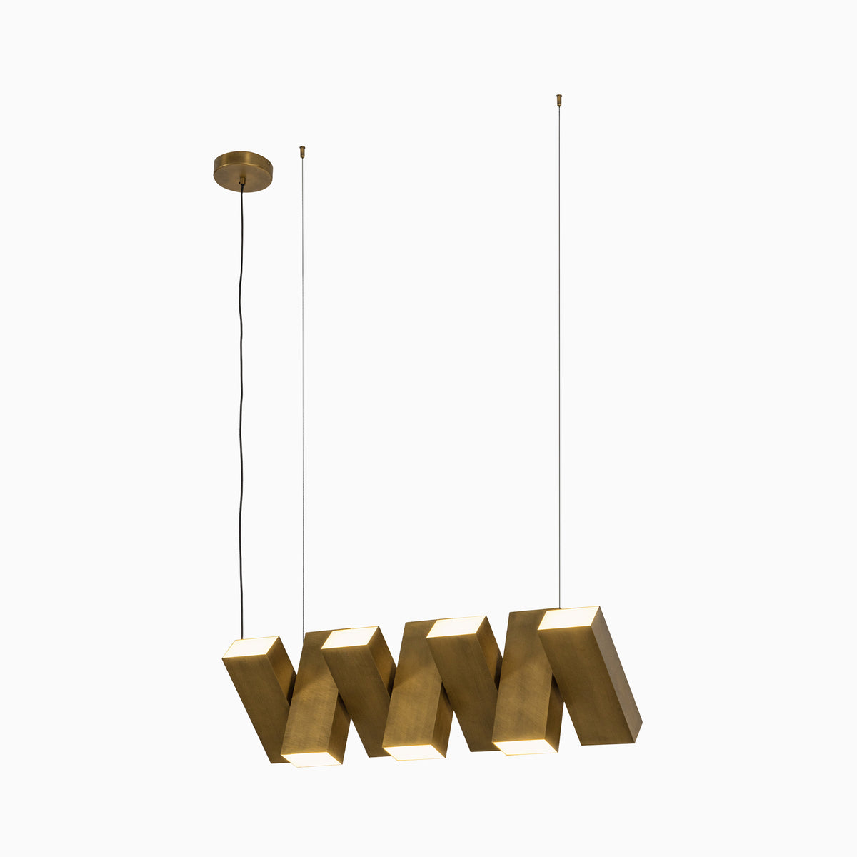 Modern geometric pendant light in vintage brass finish with sculptural rectangular forms and integrated LED illumination, suspended by slim cables from a round canopy.