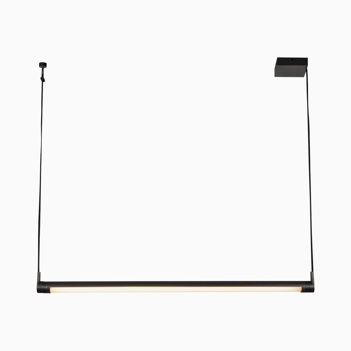 Linear matte black pendant light with a cylindrical bar and integrated LED strip, suspended by cords to create streamlined task lighting for contemporary interiors.