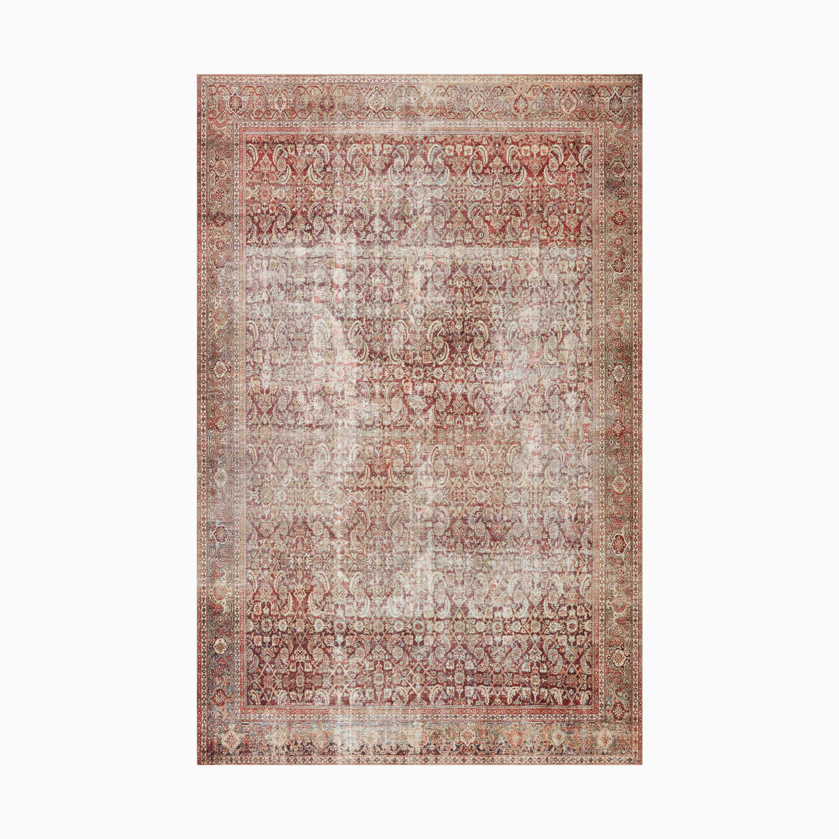 Faded Persian-style power loomed rug made of polyester with intricate paisley and floral motifs in soft beige, rust, and ivory tones for a vintage, timeworn appeal.