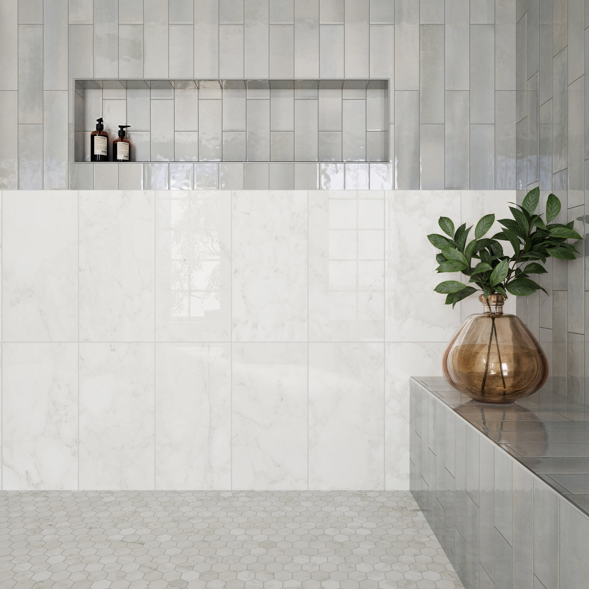 A serene bathroom featuring polished Carrara Bianco marble look tiles with soft veining, paired with glossy subway tiles and hexagonal floor tiles for a refined look.