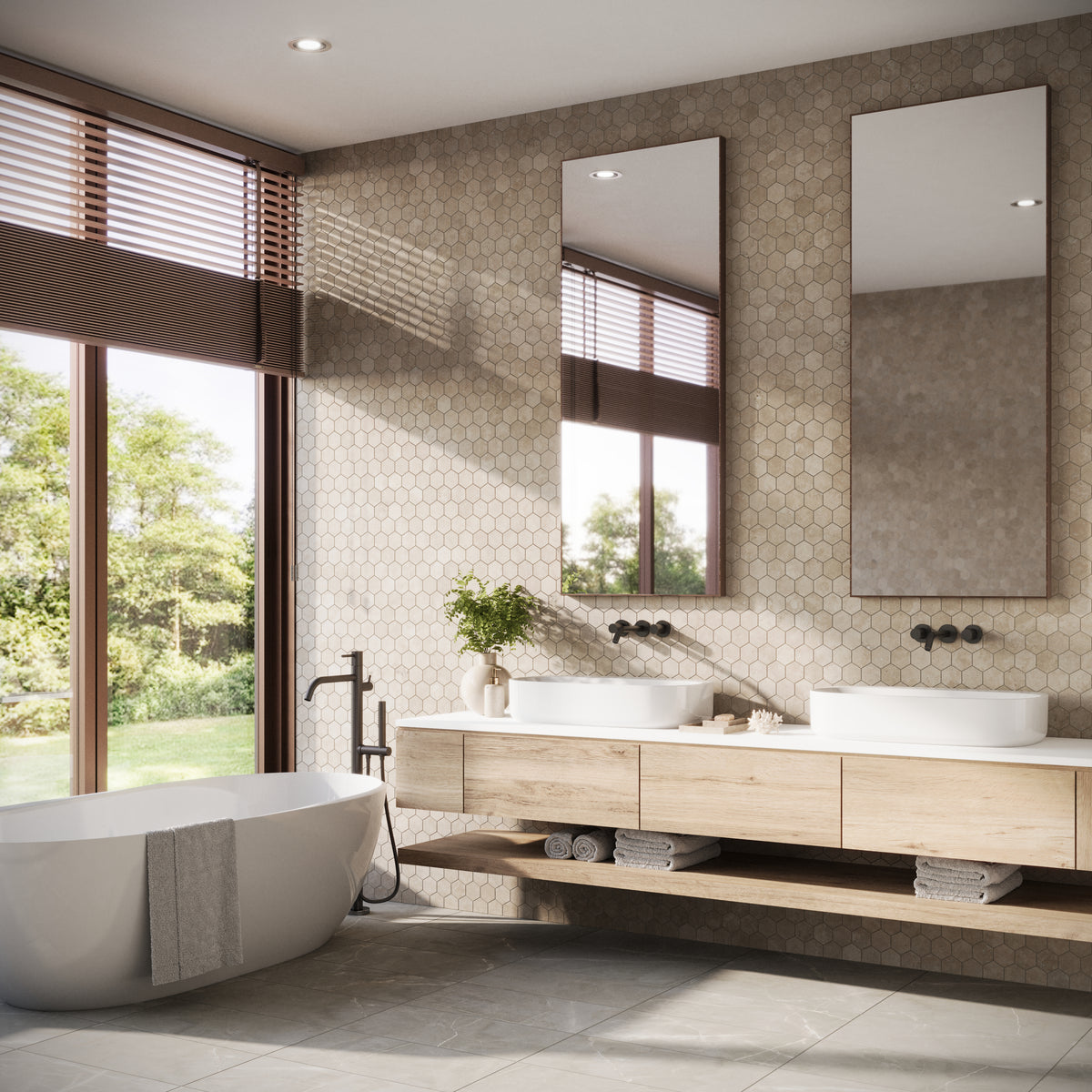 Modern bathroom featuring a textured accent wall with Leona Marfil 3x3 hexagon mosaic matte tiles, paired with a freestanding bathtub and natural wood vanity.