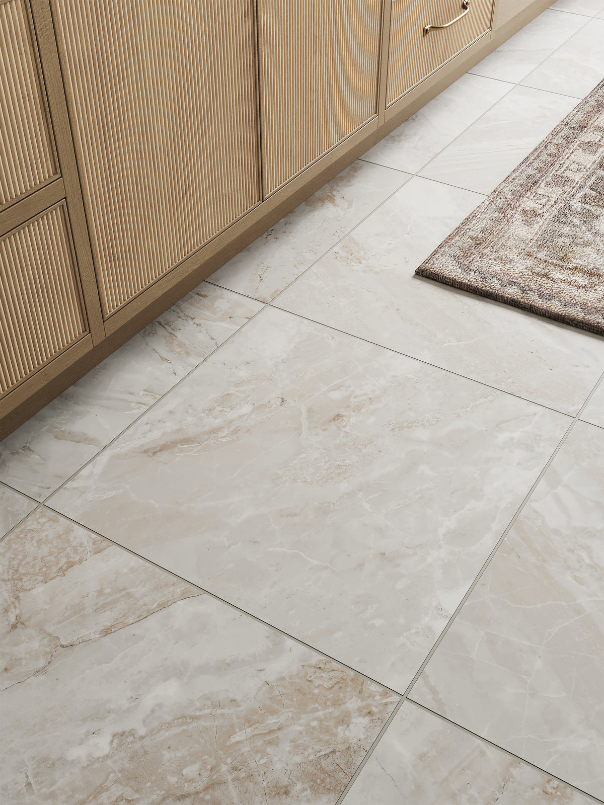 Stylish taupe marble look floor tiles in a matte finish, complementing natural wood cabinetry and a textured rug for a warm, cohesive design.