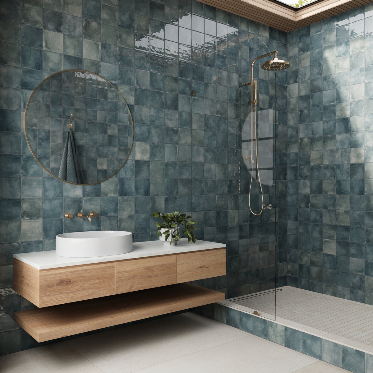 Bathroom featuring Lilah Marine 6x6 glossy tiles on the walls, a floating wooden vanity, a round mirror, and a sleek glass shower.