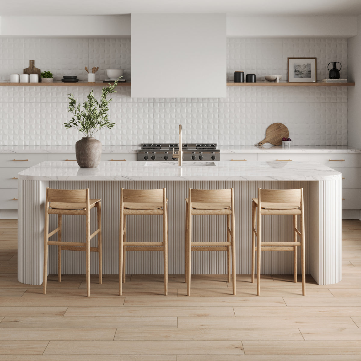 Modern kitchen with a fluted white island topped by a marble countertop, Zayne 12x36 matte ceramic tile in a 3D white block pattern, and warm matte wood-look flooring.