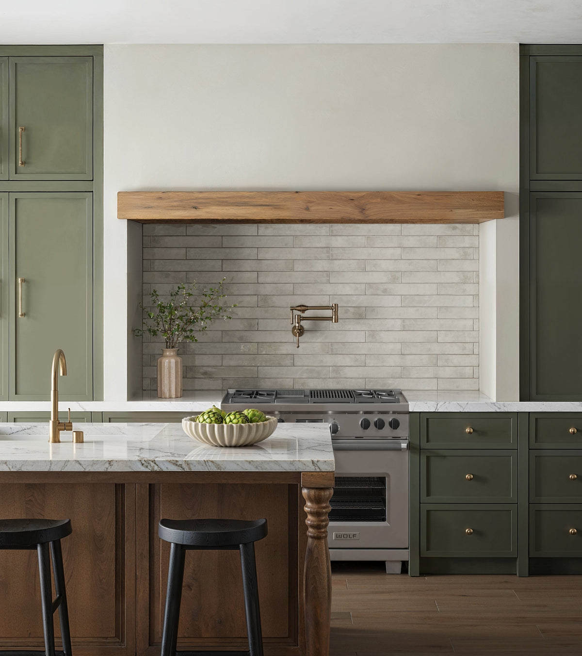 Rustic kitchen design featuring Jaden Dove 2.5x16 gloss tiles as a backsplash, harmonizing soft gray tones with natural wood and green cabinetry.