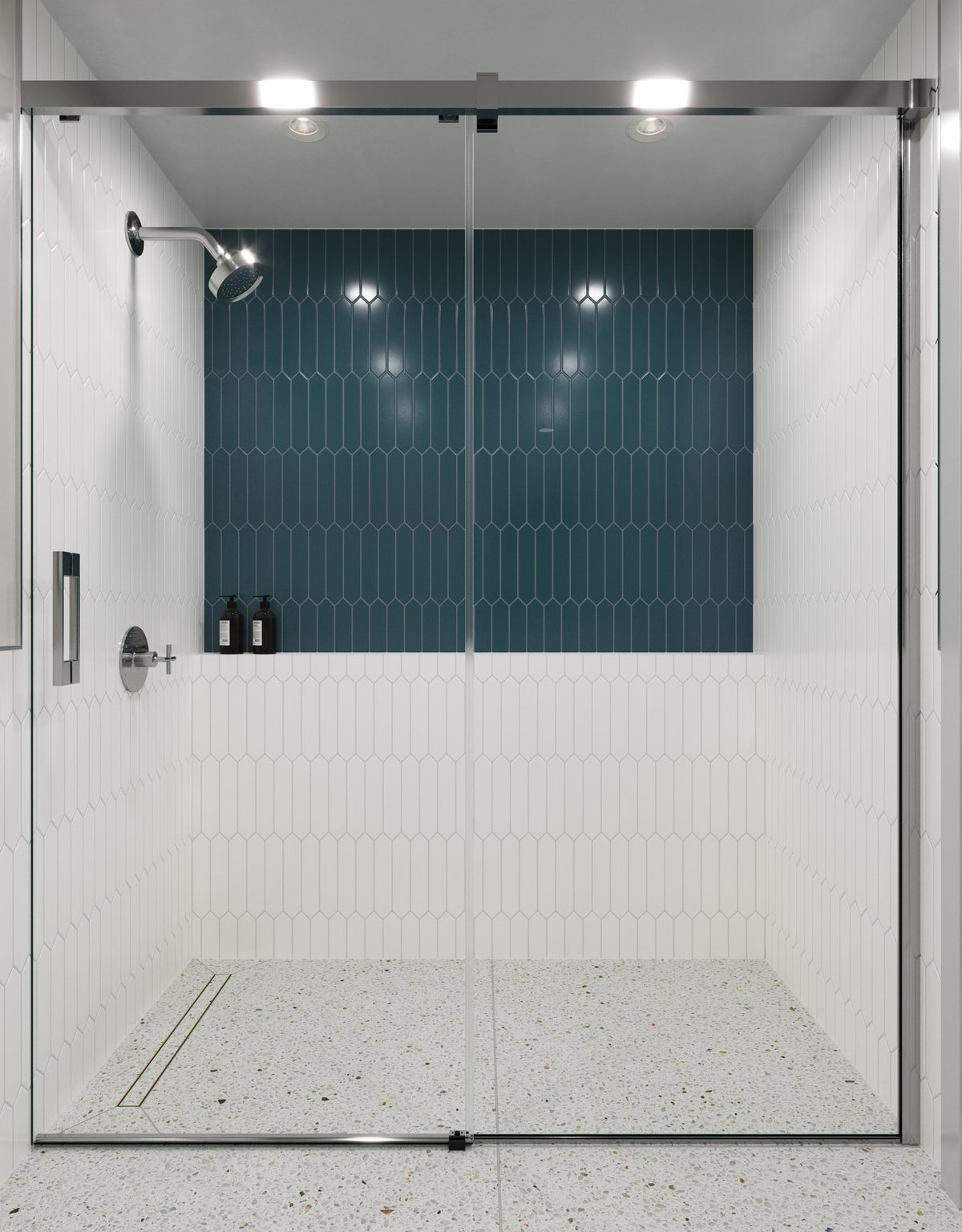 Sleek shower featuring matte blue picket tiles as a bold accent wall, paired with white picket tiles and terrazzo flooring for a contemporary design.