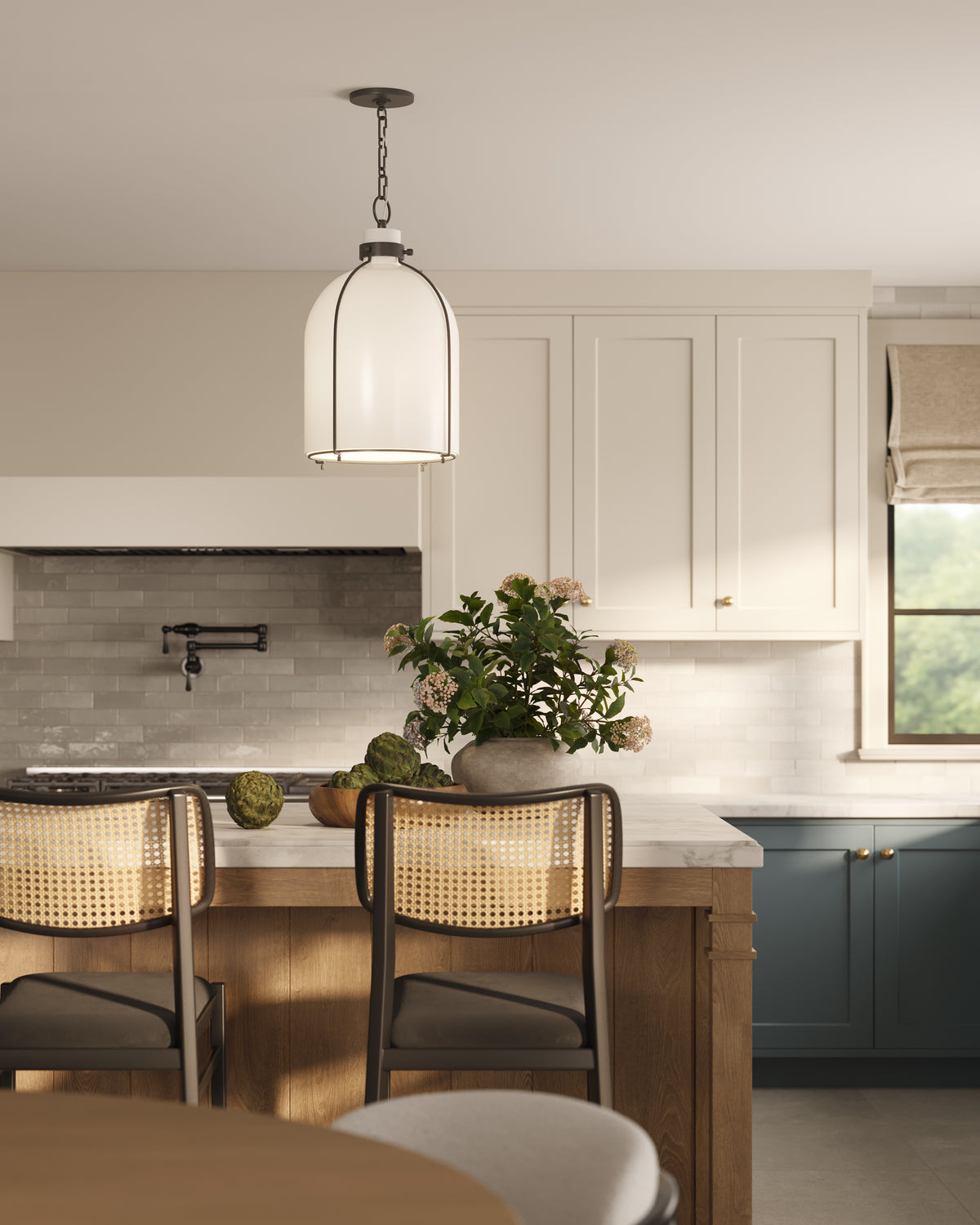 Kitchen island with marble countertop, woven bar stools, and old bronze dome pendant light above, adding warm ambient lighting.