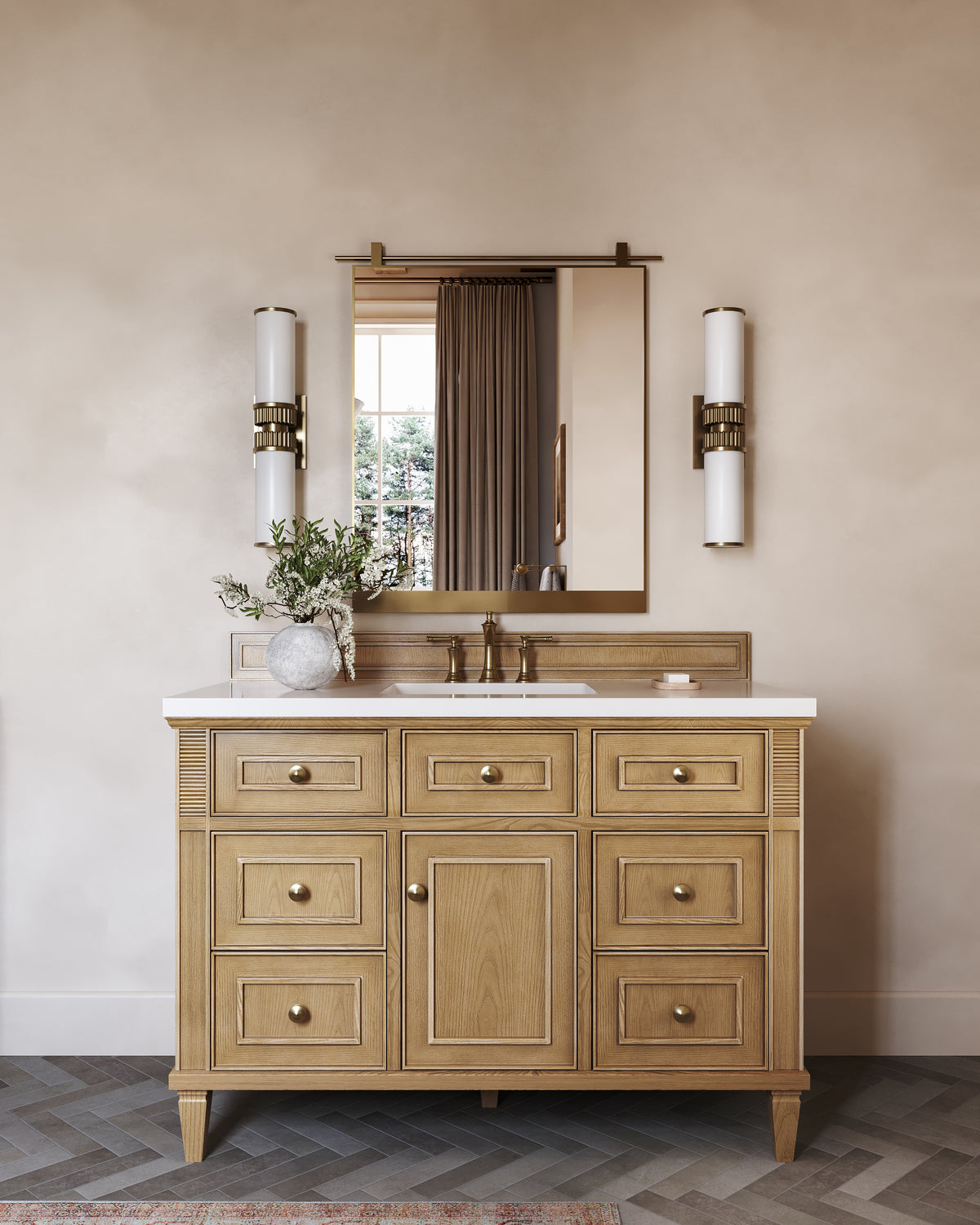 Elodie 48-inch single vanity in light natural oak with White Zeus quartz countertop, styled with a brass mirror, dual wall sconces, and warm neutral bathroom decor.