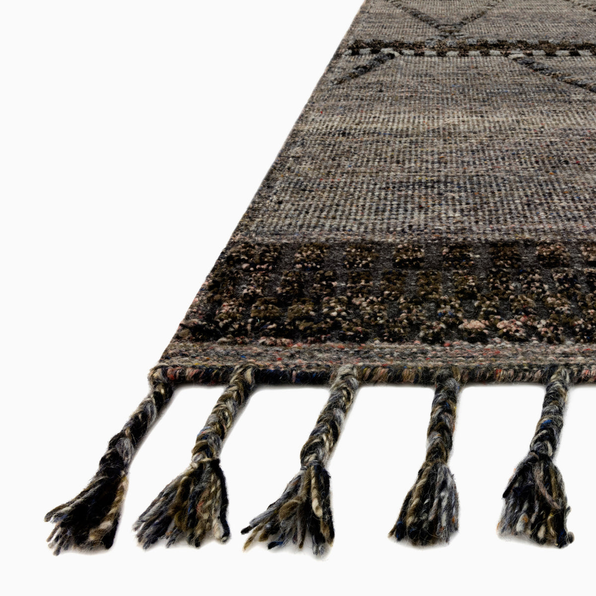 Micah Wool Blend Rug in Graphite / Espresso with a deep charcoal base and subtle brown undertones, finished with delicate fringe detailing.