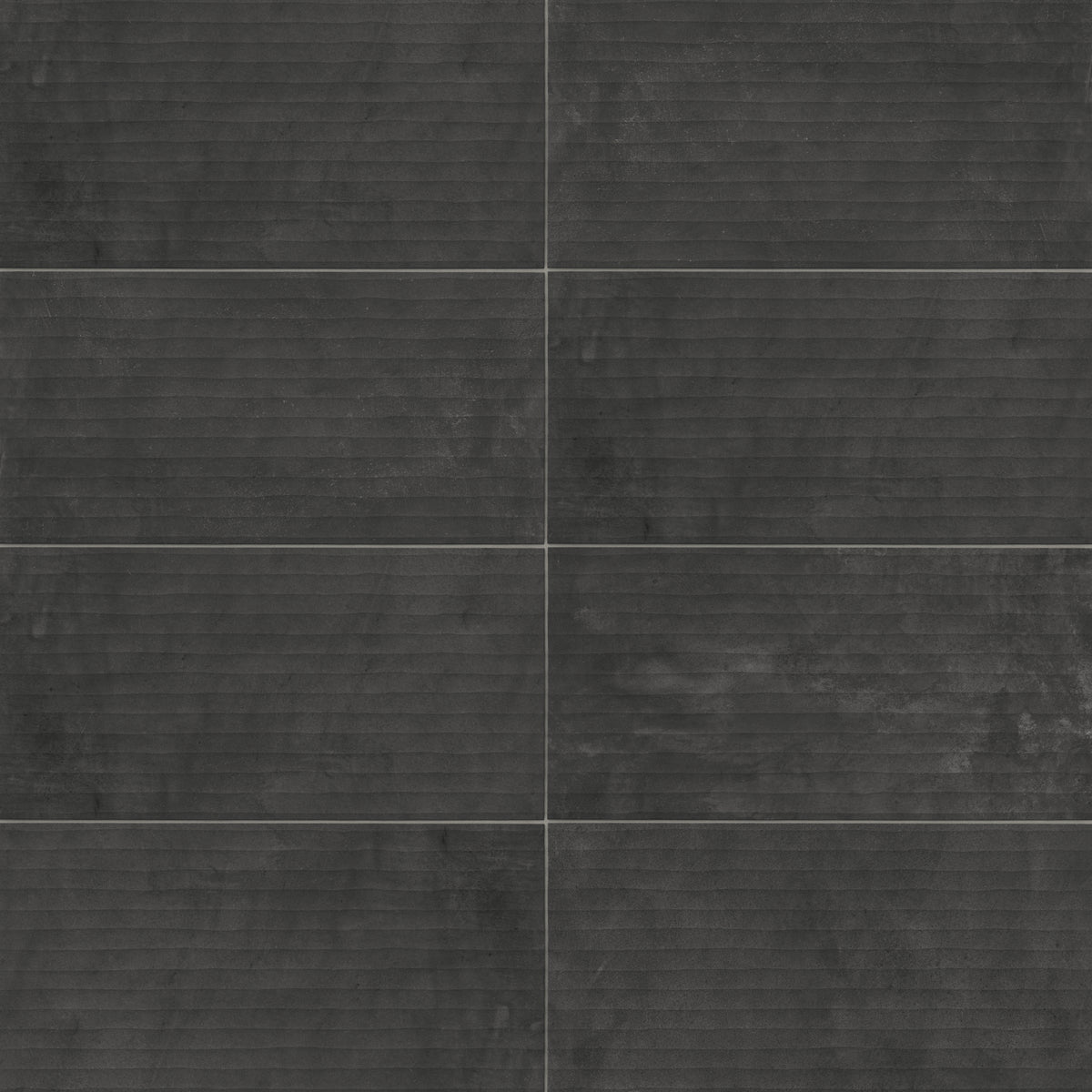 Rectangular porcelain tile with a fluted surface featuring linear grooves and a lightly textured finish, showcasing a dark gray color with subtle tonal variation and natural shading.