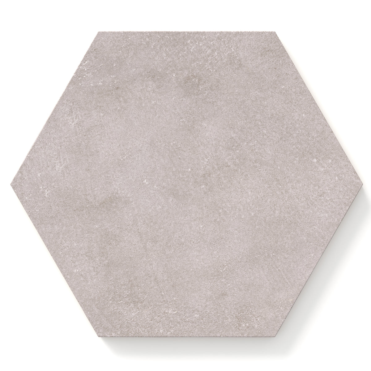 Hexagon porcelain tile in a matte finish with a smooth, lightly textured surface, featuring a light warm gray color with soft natural variation and subtle speckling.