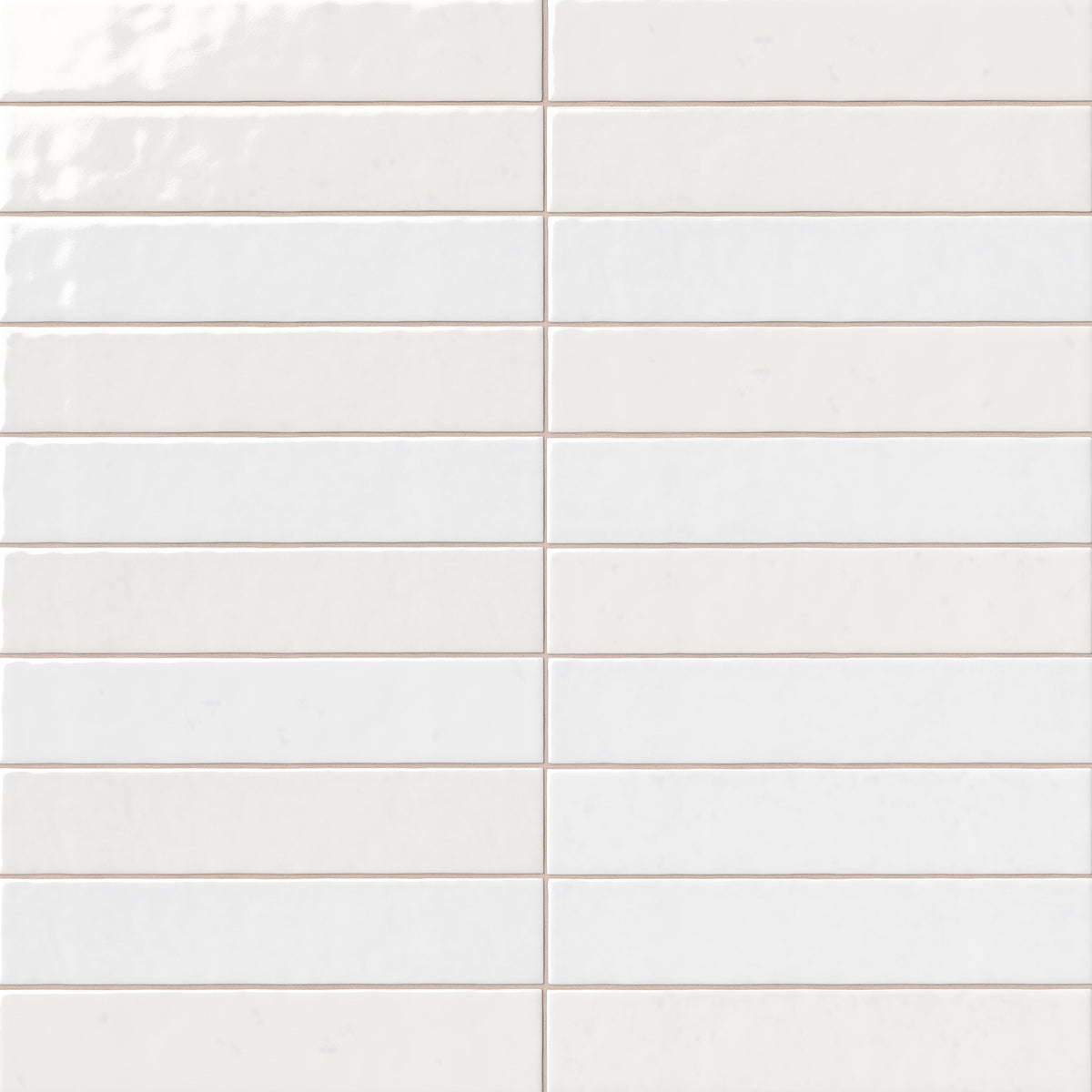 White 2x13 ceramic wall tiles with a handcrafted appearance, lustrous glazed finish, and softly uneven edges that bring depth and texture to the installation.