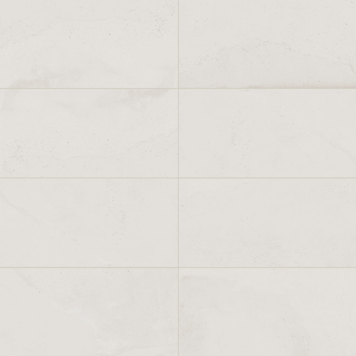 Off-white matte porcelain tile in a classic rectangular format, featuring visual mineral flecks inspired by the shifting texture of Italian Riviera sand.