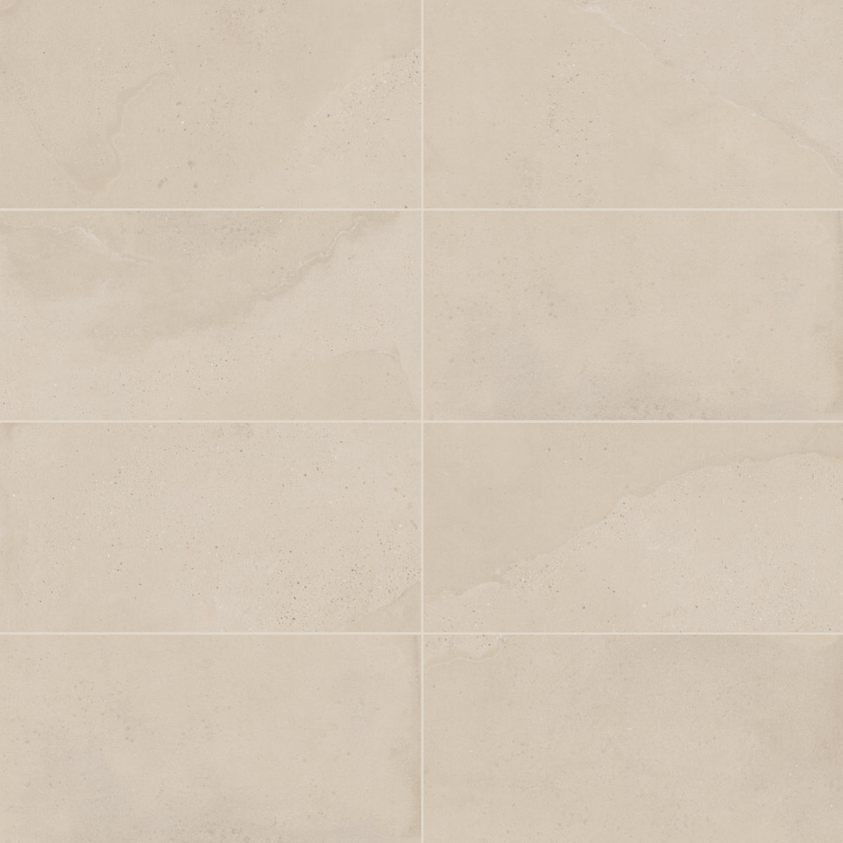 Warm beige matte porcelain tile in a classic rectangular format, featuring visual mineral flecks inspired by the shifting texture of Italian Riviera sand.